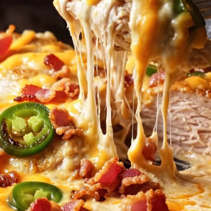 Golden seared chicken breasts smothered in a creamy jalapeño and sharp cheddar sauce with crispy bacon.