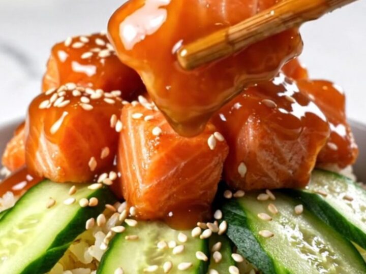 Crispy golden-brown salmon bites glazed in a creamy spicy Bang Bang sauce, served over jasmine rice.