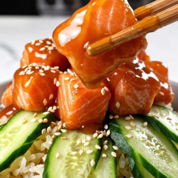 Crispy golden-brown salmon bites glazed in a creamy spicy Bang Bang sauce, served over jasmine rice.