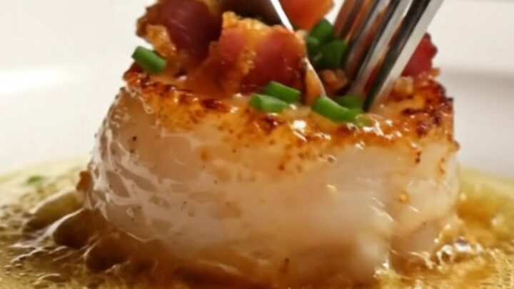 Golden-crusted jumbo sea scallops seared to perfection in a stainless steel skillet with crispy pancetta.