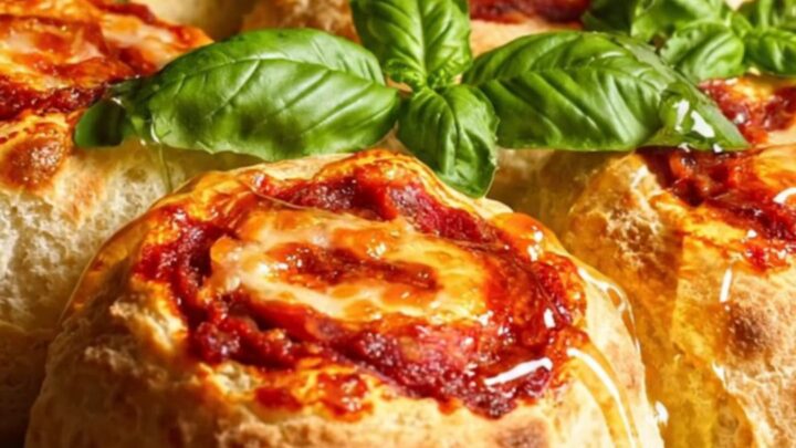 A close-up of a spicy nduja and provola pizza pinwheel showing the swirled layers.