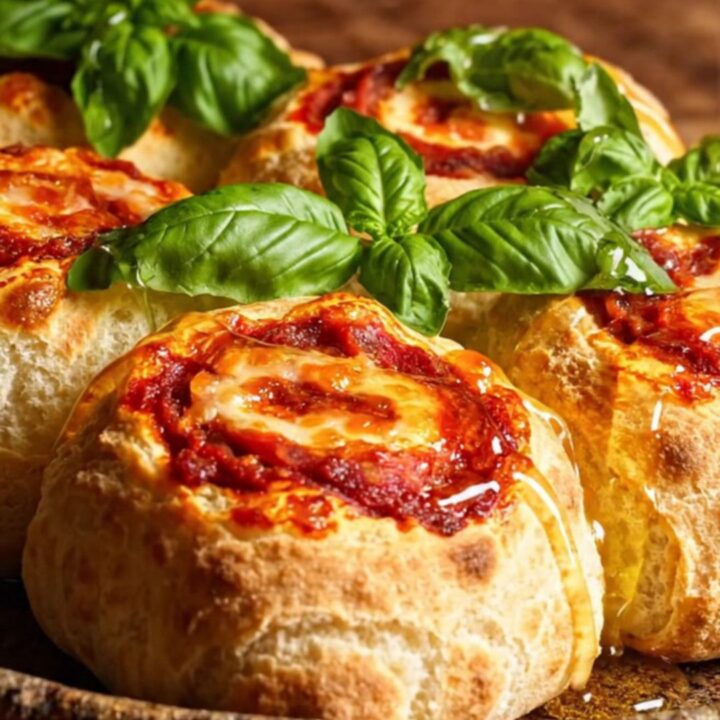 A close-up of a spicy nduja and provola pizza pinwheel showing the swirled layers.