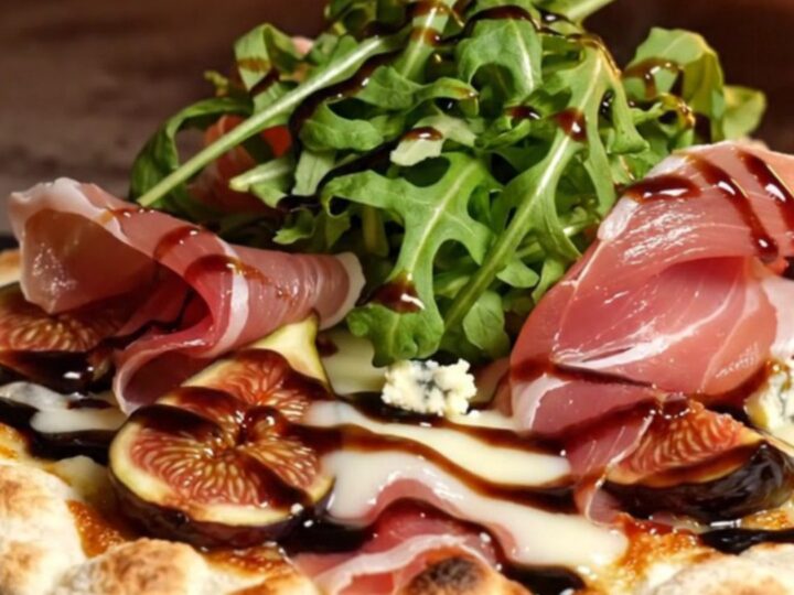 A crispy artisan flatbread topped with caramelized mission figs, crumbled gorgonzola, and glistening balsamic reduction.