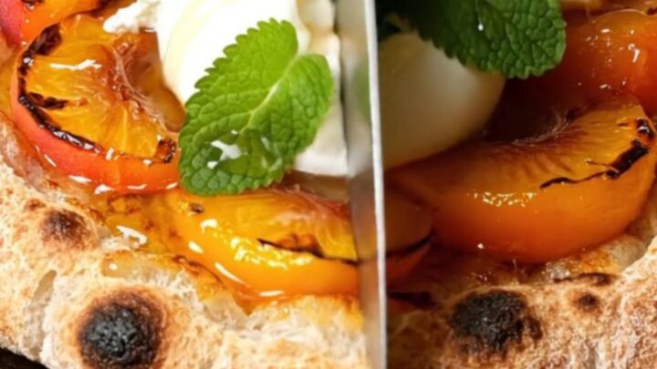 A close-up of a grilled sourdough flatbread topped with charred peach wedges and creamy burrata cheese.