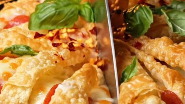 A close-up of a golden, accordion-pleated phyllo pizza tart with bubbling mozzarella and pepperoni.