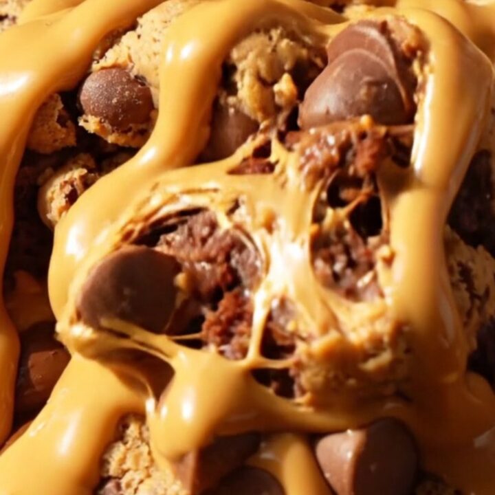 A warm, decadent brookie skillet featuring layers of fudge brownie and cookie dough with a molten peanut butter center.