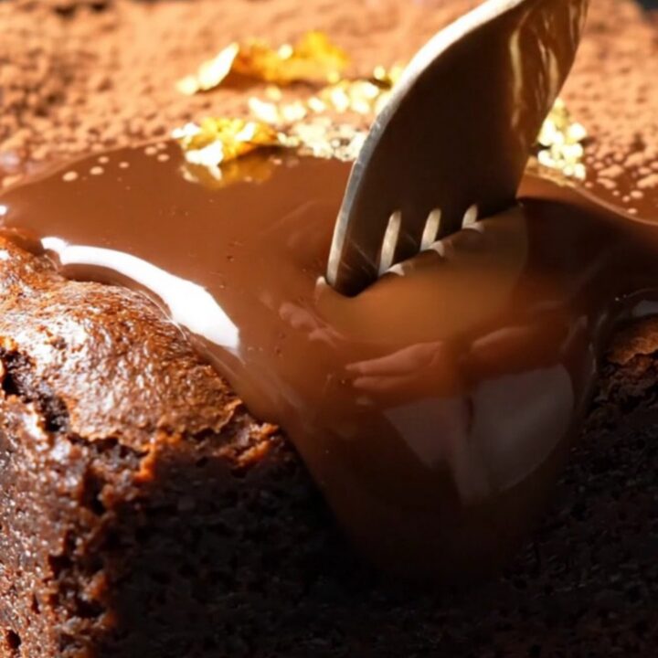 A warm, decadent espresso Kahlua brownie with a glossy dark chocolate ganache topping.