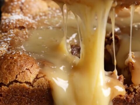 A golden, soft white chocolate blondie with a rich, glossy horchata glaze dripping down the sides.