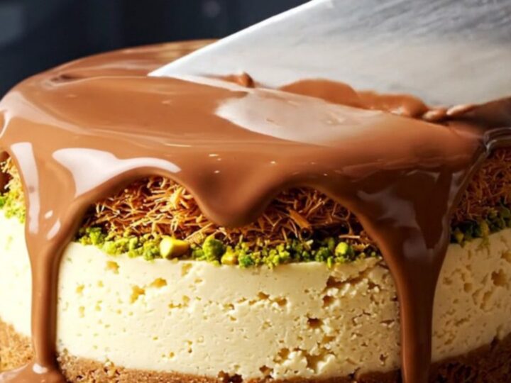 A close-up shot of a Dubai pistachio kunafa cheesecake bar with a visible crunchy pistachio layer.