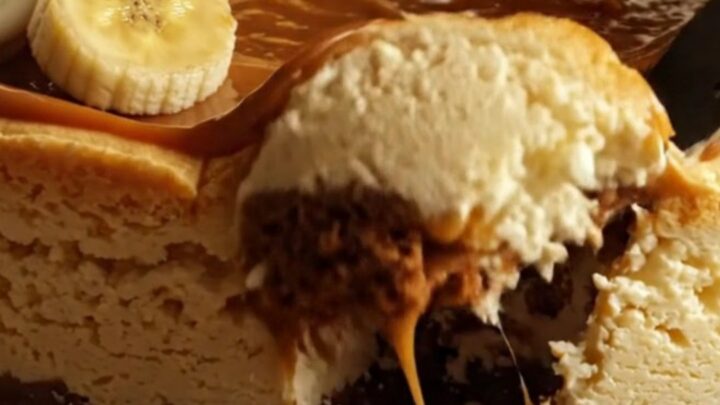 A slice of decadent banoffee cheesecake with a biscuit base and caramel topping.