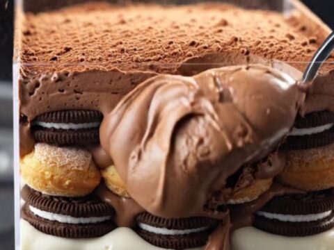 A towering, decadent Oreo Fudge Mocha Tiramisu Box with visible layers of chocolate mousse and espresso-soaked cookies.