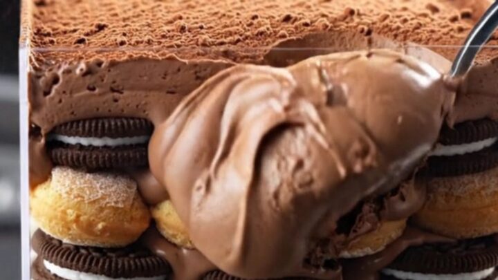 A towering, decadent Oreo Fudge Mocha Tiramisu Box with visible layers of chocolate mousse and espresso-soaked cookies.