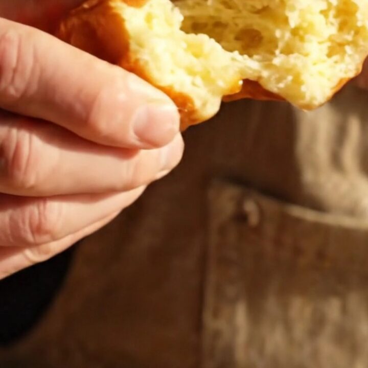 A close-up of a warm Belgian Liège waffle showing the texture of the caramelized sugar.