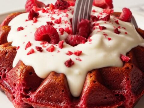 Crispy red velvet Belgian waffles drizzled with white chocolate ganache and freeze-dried raspberries.