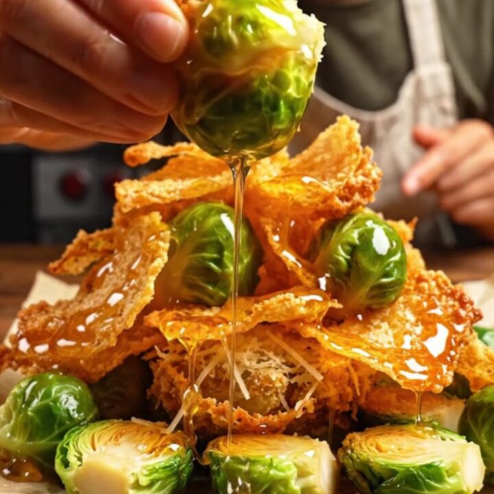 Crispy smashed Brussels sprouts with a golden parmesan crust on a rustic table.