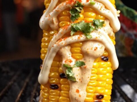 A close-up shot of crispy, golden corn ribs curled into shapes