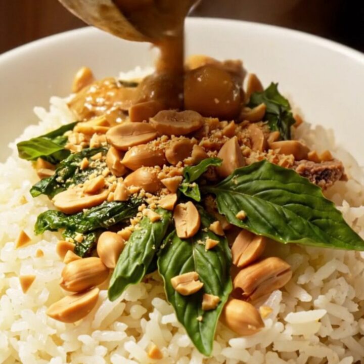 A close-up shot of creamy Massaman curry with tender short ribs and potatoes in a glazed stoneware Crockpot.