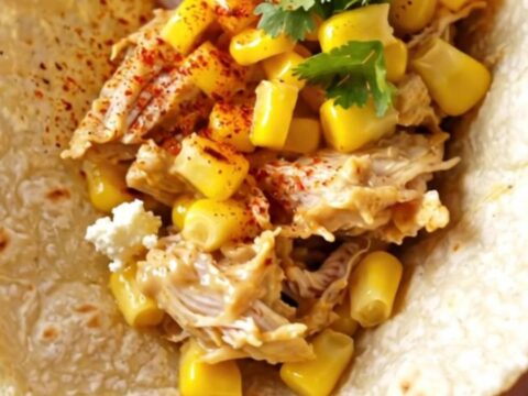 Creamy shredded chicken with roasted corn and cotija cheese served in warm flour tortillas.