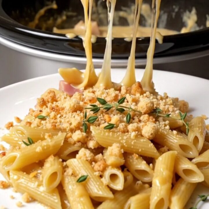 A golden, creamy serving of Chicken Cordon Bleu pasta topped with panko crumbs and fresh thyme.
