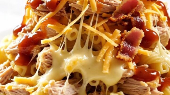 A close-up of a creamy Hawaiian BBQ chicken pasta bake served in a white ceramic bowl.