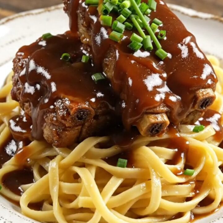 Succulent country-style pork ribs glistening with a thick, dark root beer and molasses glaze