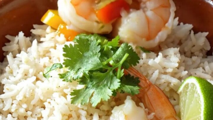 A warm, rustic clay bowl filled with vibrant Brazilian moqueca