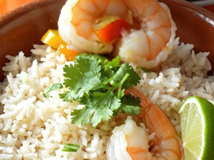A warm, rustic clay bowl filled with vibrant Brazilian moqueca